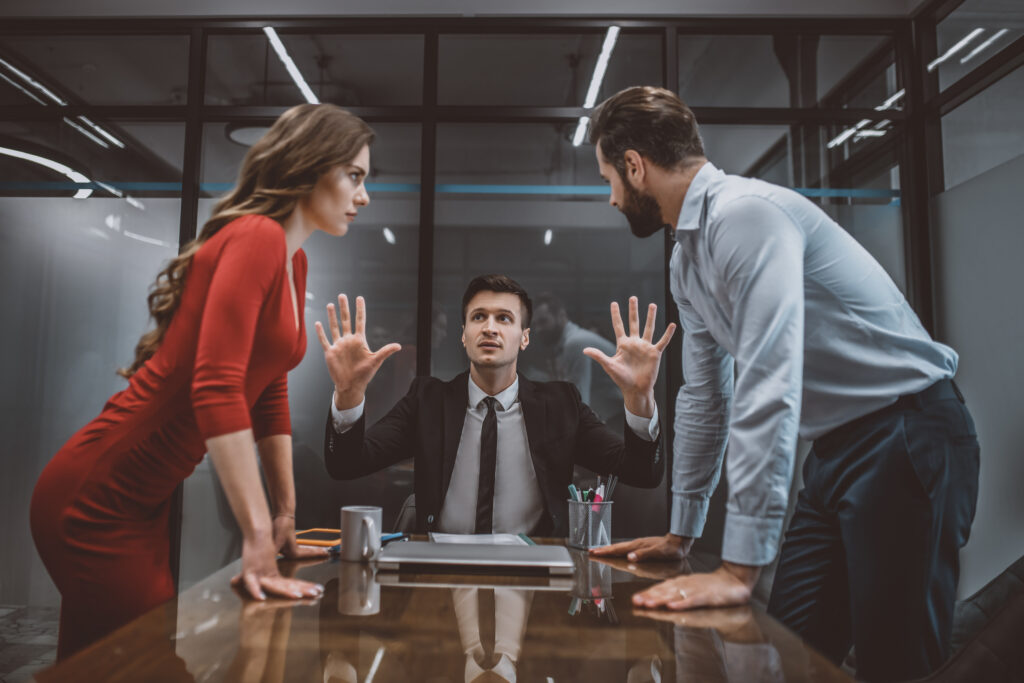 Lawyer trying to stop the argument between two people