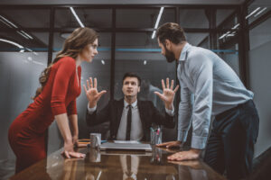 Lawyer trying to stop the argument between two people